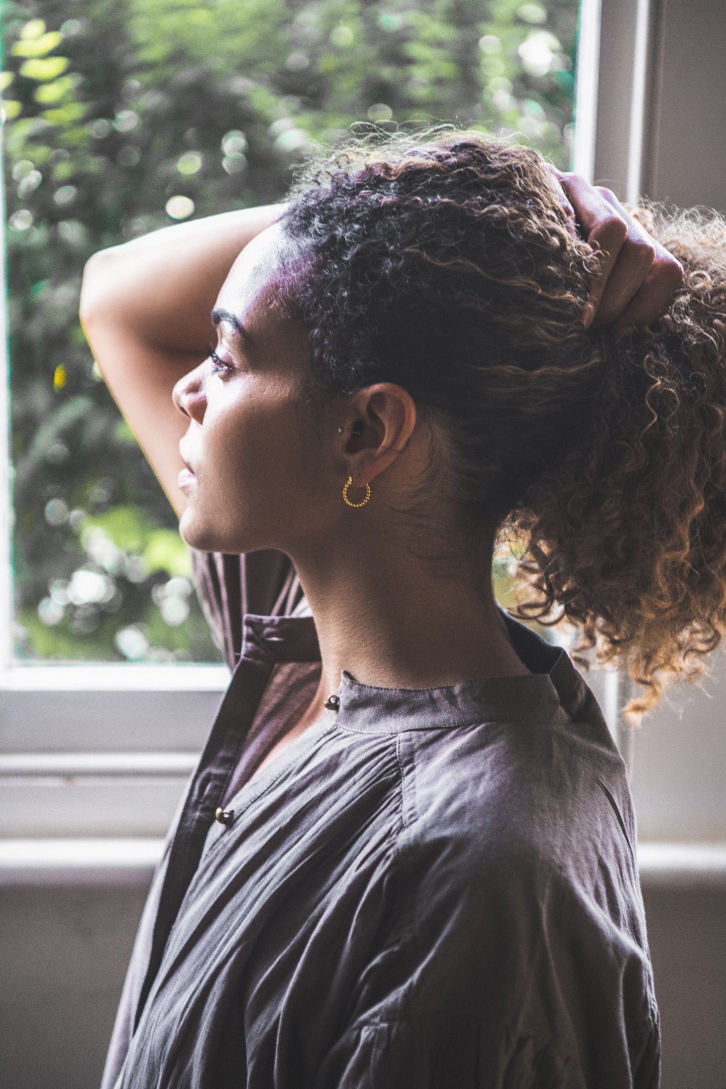 Woman wearing Small Bobble Hoop earring