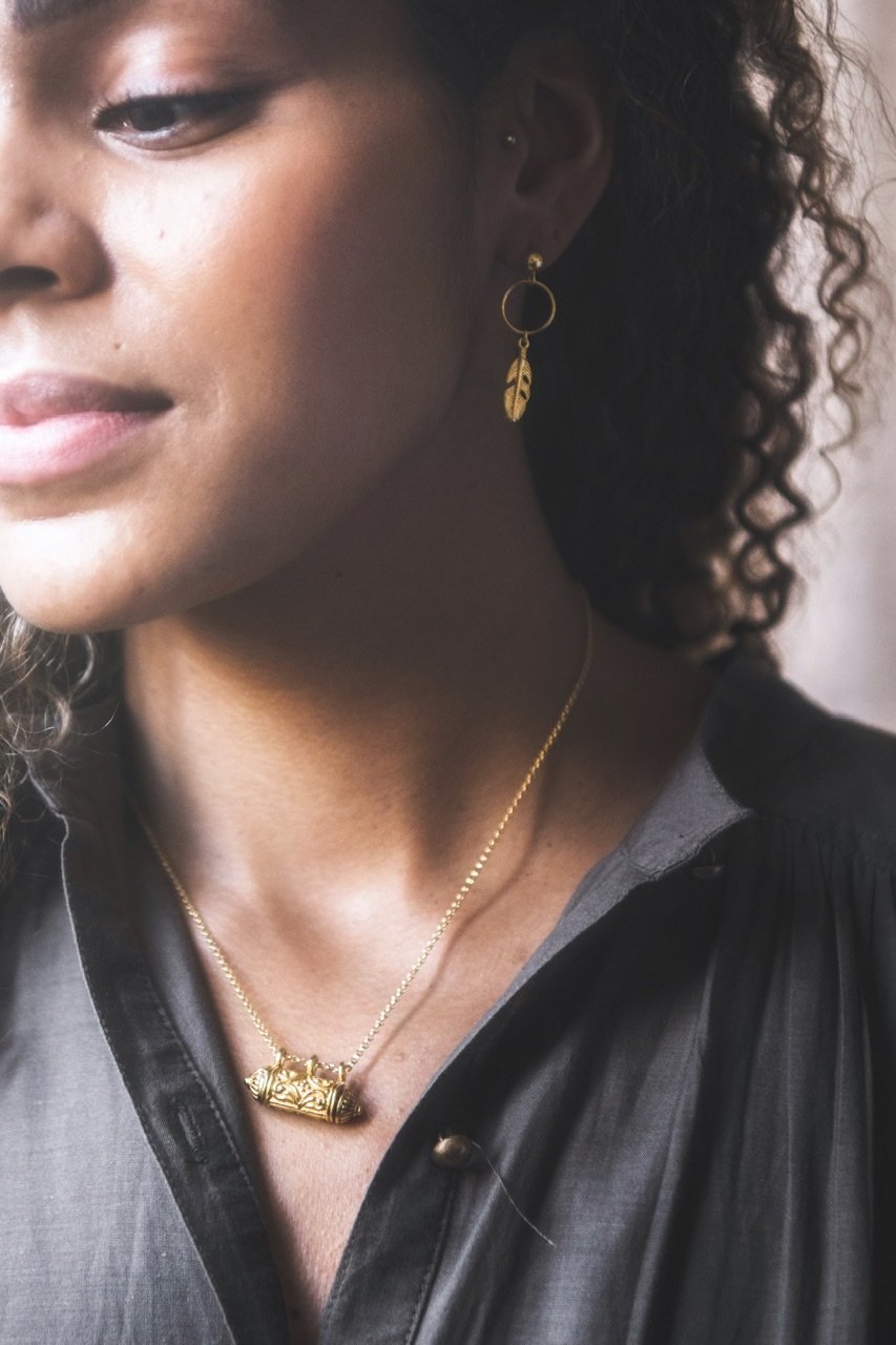 Close up of woman wearing Kiaria Wishing Locket