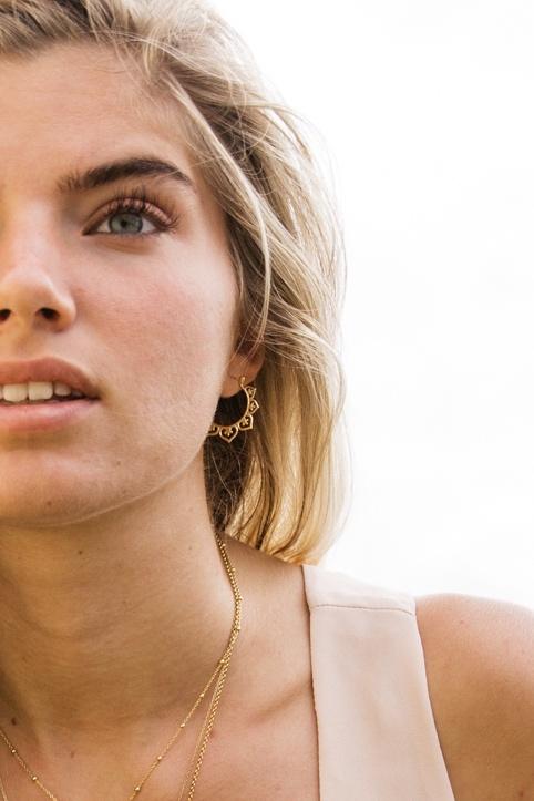 Close up of woman wearing Small Boho Hoop earring