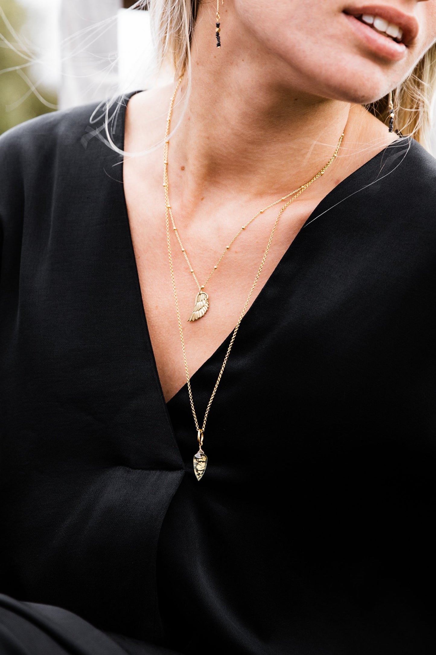 Woman wearing Angel Wing Satellite Chain Necklace