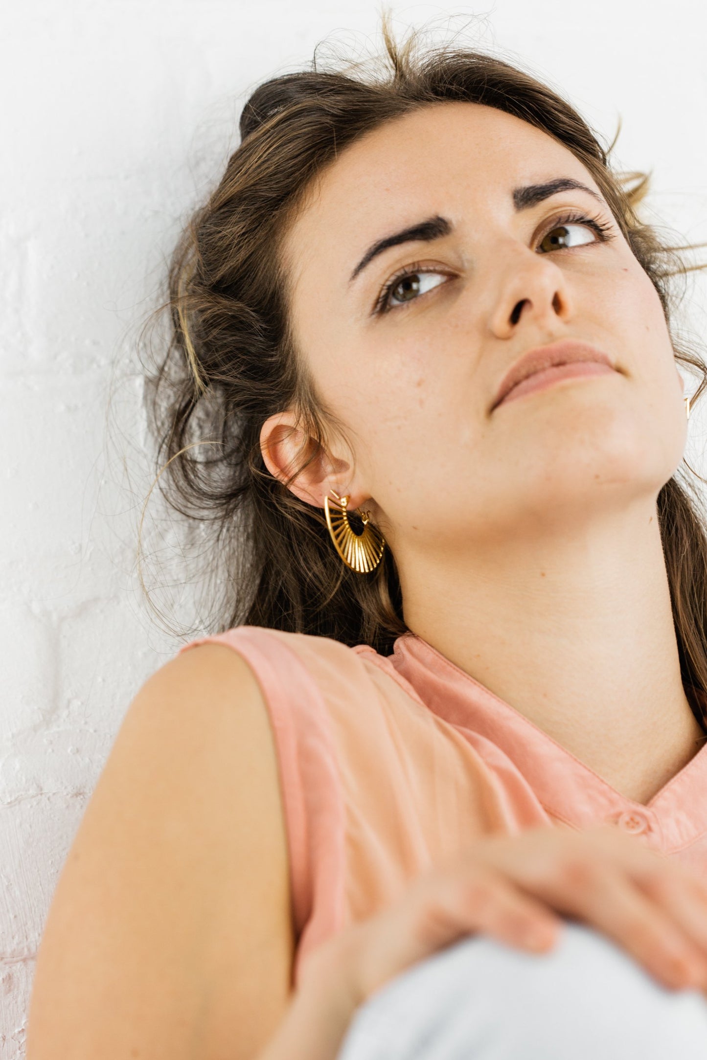 Woman wearing Georgia Half Moon Art Deco Hoop Earring