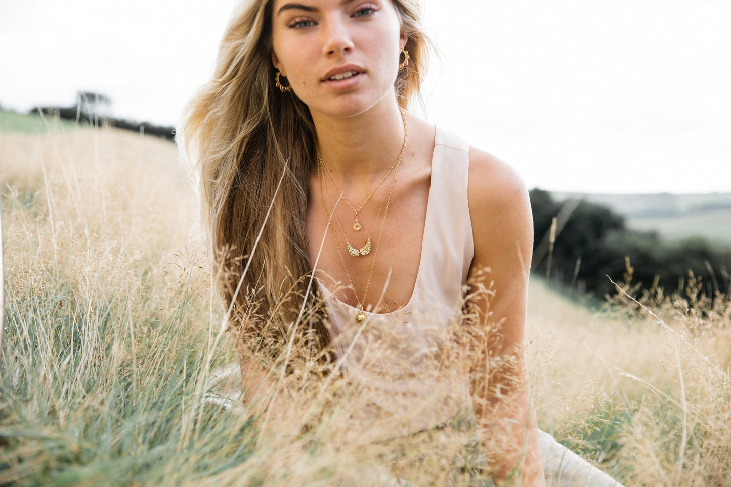 Woman wearing Double Angel Wing Necklace