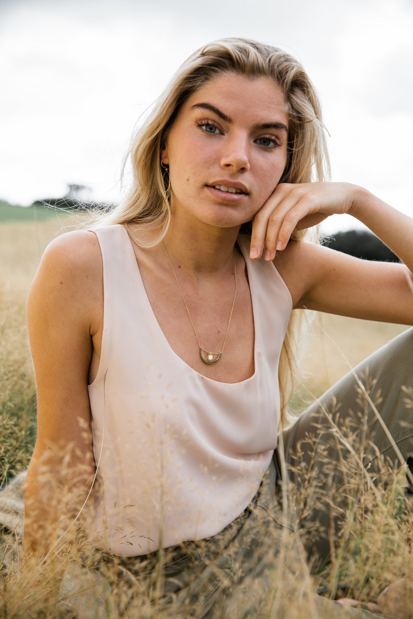Woman wearing Guardian Crescent Clear Quartz Drop Necklace