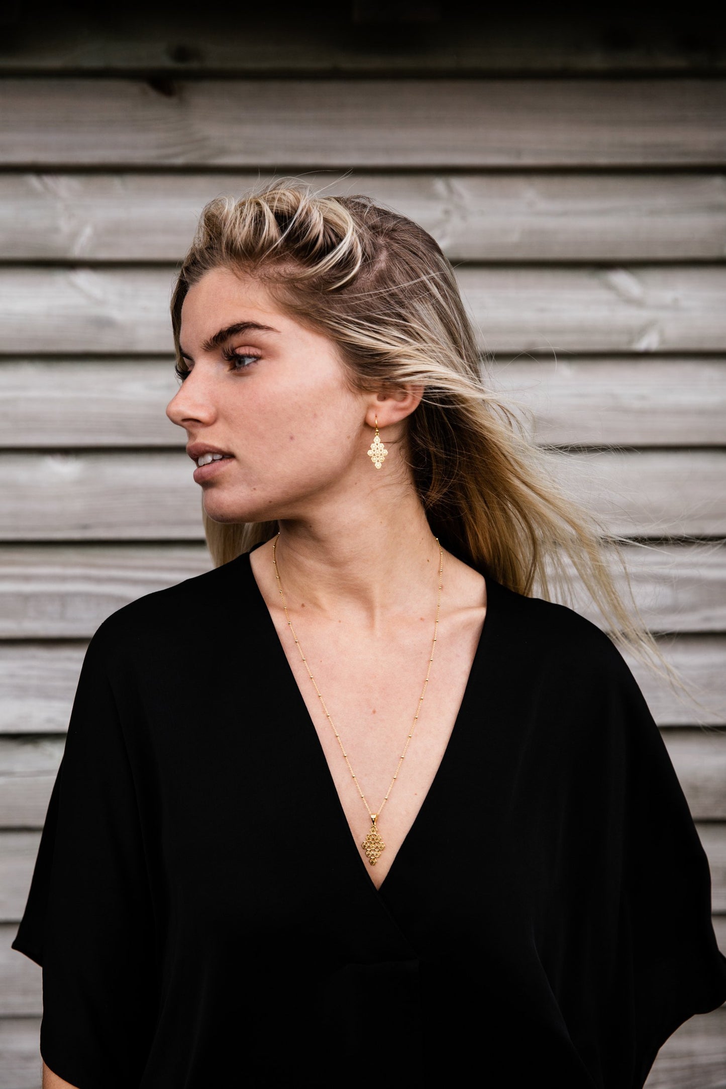 Woman wearing Emmy Diamond Drop Flower Earring 