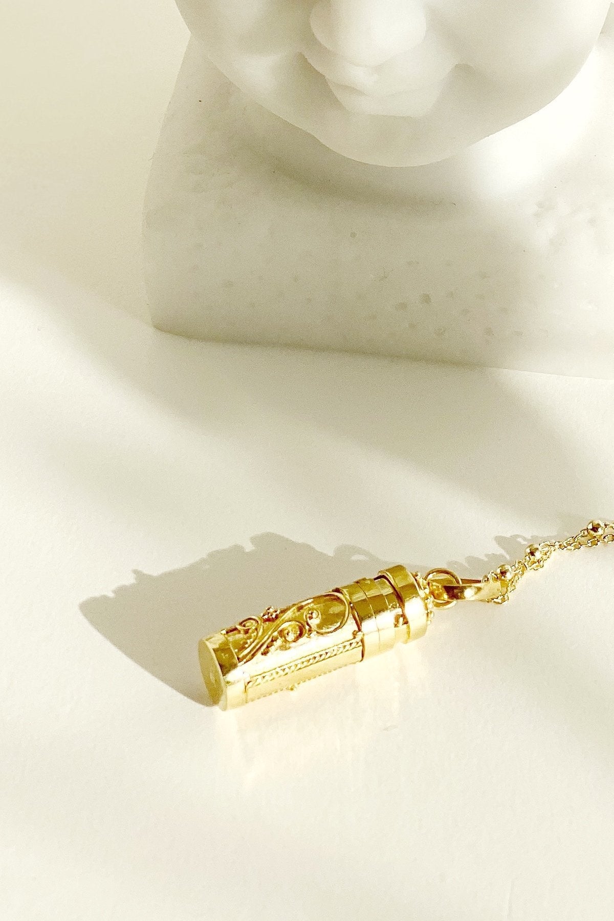 Close up of Antiena Wishing Locket on a surface