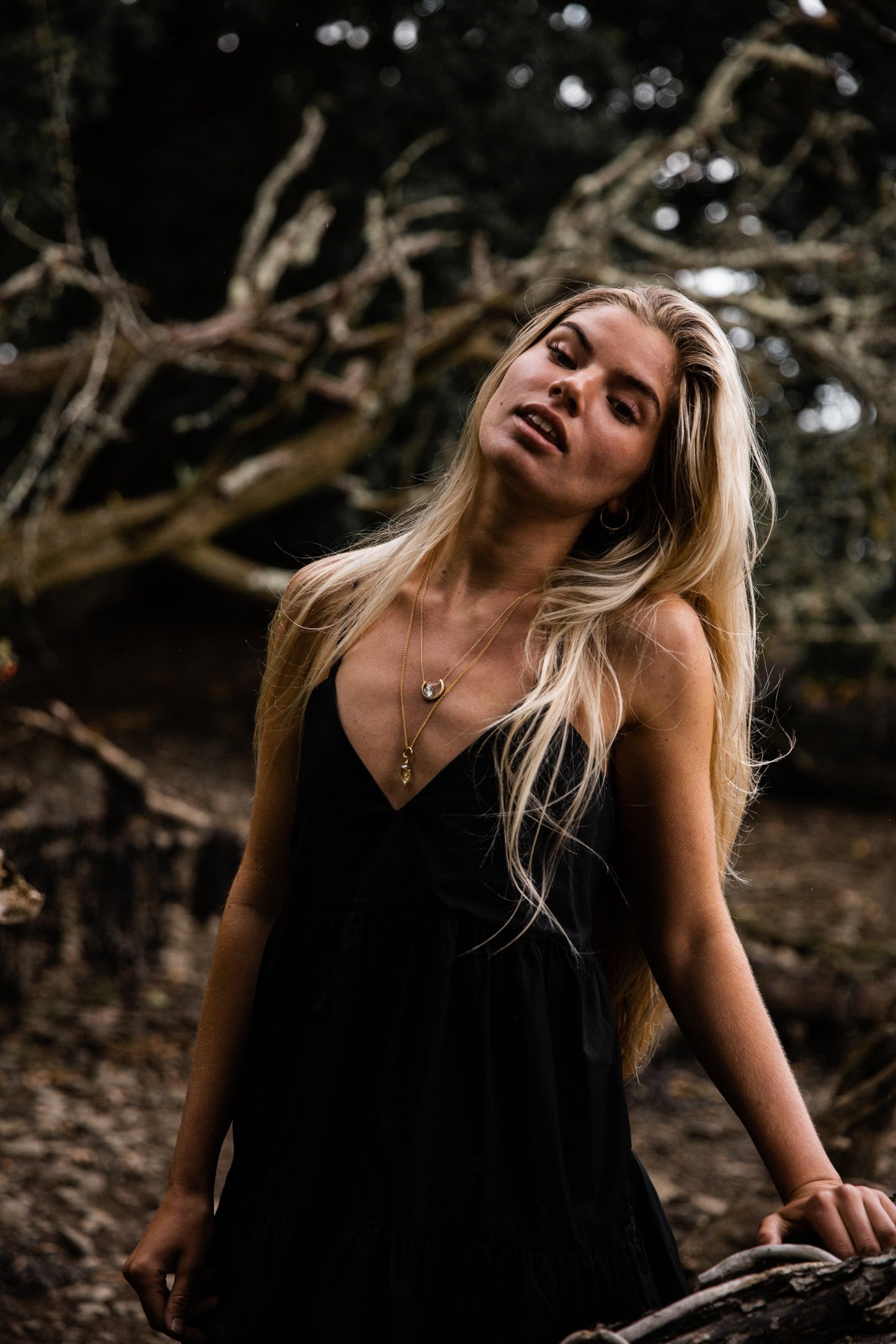 Woman wearing Guardian Luna Blue Topaz Necklace