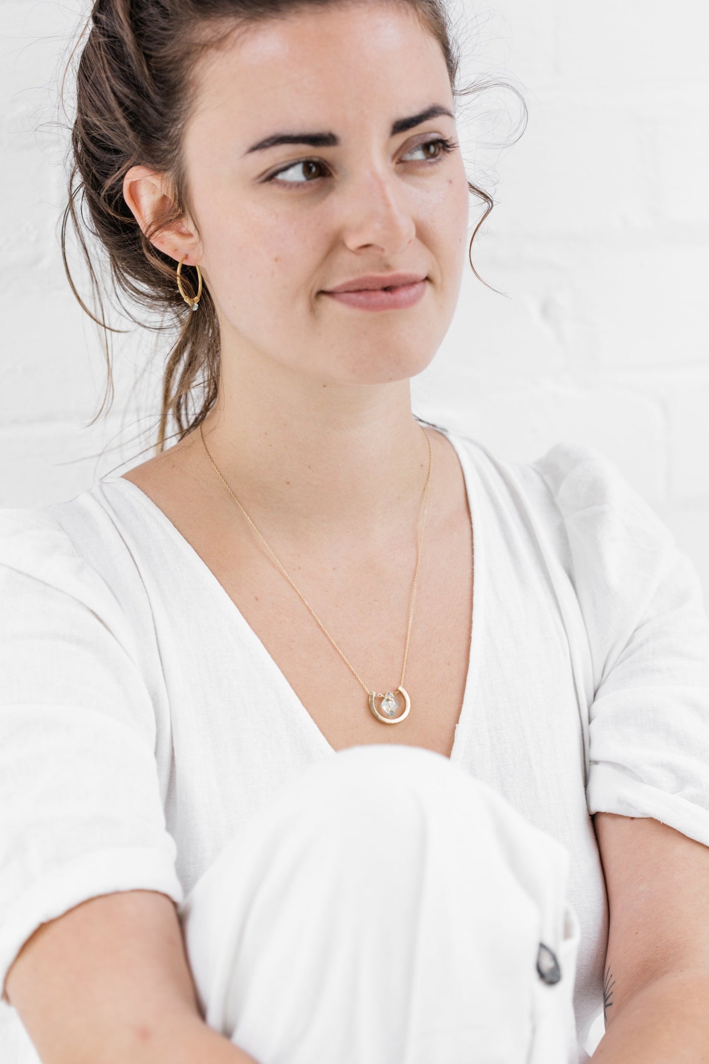 Woman wearing Guardian Luna Blue Topaz Necklace