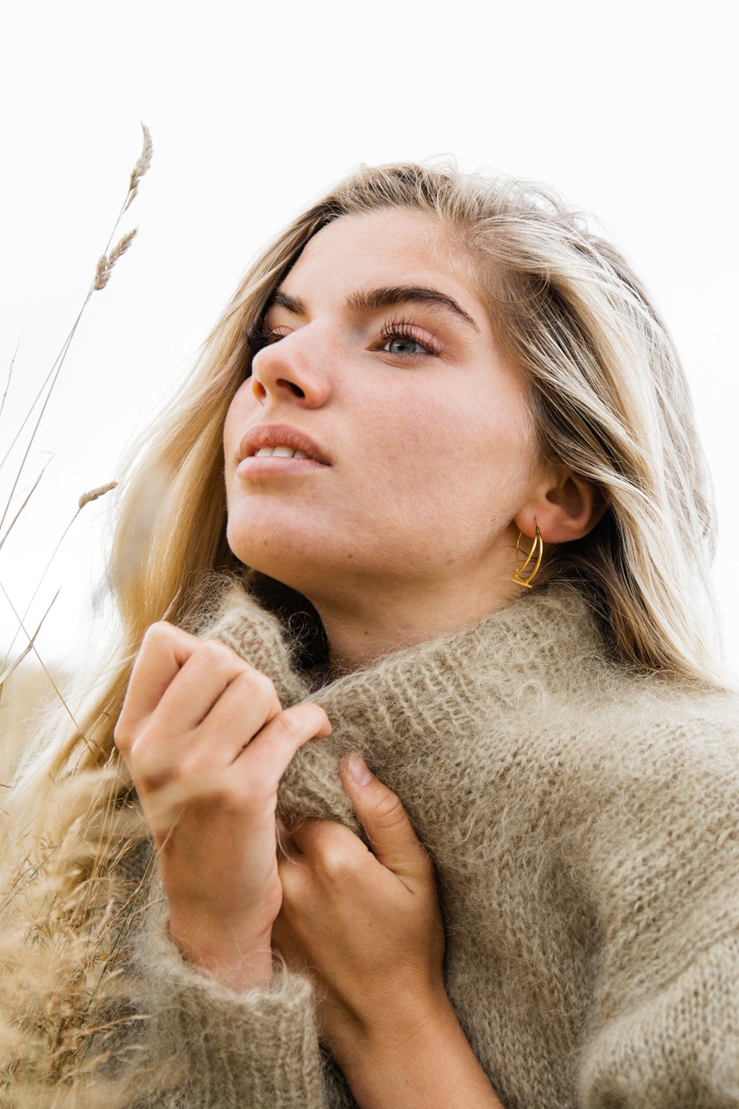 Woman wearing Jaqueline Triangle Drop Earring